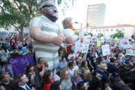 <p>Peace activists rally outside of a Donald Trump campaign rally in Phoenix, Arizona, U.S. August 22, 2017. (Sandy Huffaker/Reuters) </p>