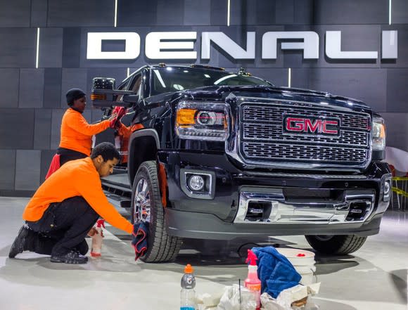 A GMC truck being detailed for a show.