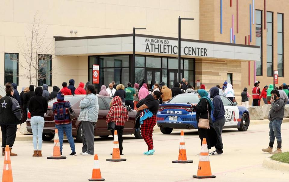 Family members wait in line to be reunited with students at the Arlington ISD Athletics Center on Monday, March 20, 2023. One student was killed and another injured in a shooting Monday morning at Lamar High, causing a lockdown. Arlington police arrested a suspect.