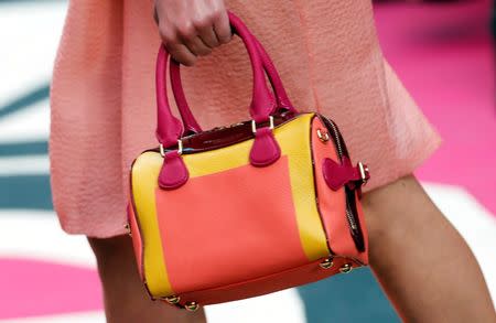 A model presents a creation from the Burberry Prorsum Spring/Summer 2015 collection during London Fashion Week September 15, 2014. REUTERS/Suzanne Plunkett