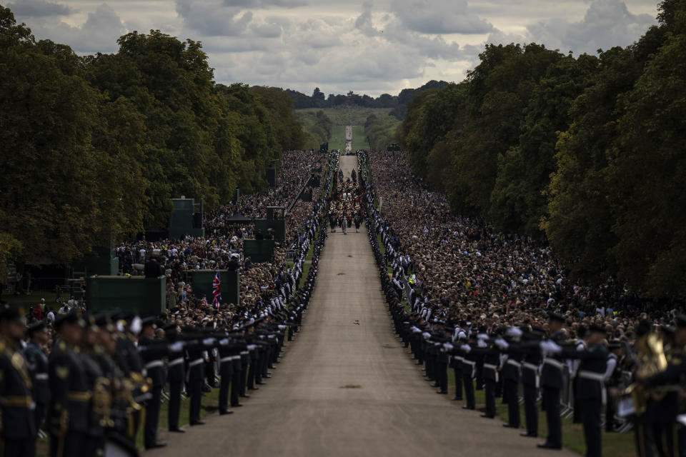 The cortege carrying the coffin of Queen Elizabeth II arrives outside Windsor Castle in Windsor, England, Monday Sept. 19, 2022. The Queen, who died aged 96 on Sept. 8, will be buried at Windsor alongside her late husband, Prince Philip, who died last year. (AP Photo/Felipe Dana, Pool)