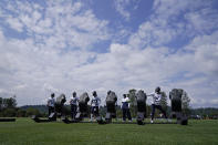 Seattle Seahawks', from left, Cody Barton (57), K.J. Wright (50), Neiko Thorpe (23), Shaquill Griffin, and Tre Flowers (21) stay distanced as they hit a blocking sled during NFL football training camp, Wednesday, Aug. 12, 2020, in Renton, Wash. (AP Photo/Ted S. Warren, Pool)