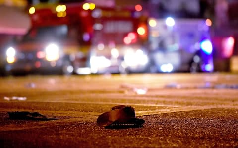 A cowboy hat lays in the street  - Credit: Getty 