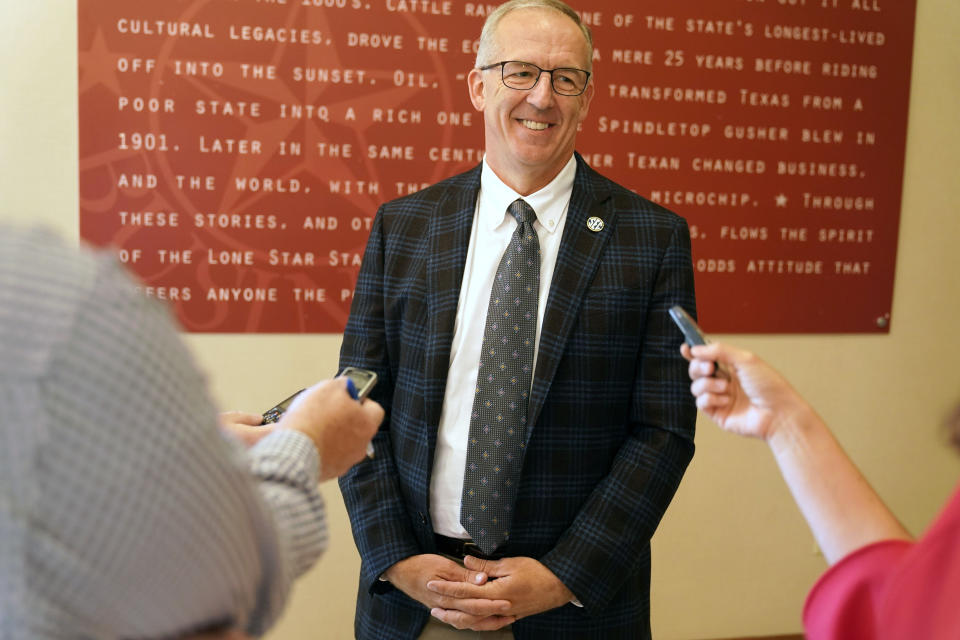Greg Sankey, commissioner of the Southeastern Conference, smiles as he speaks to reporters after the College Football Playoff meeting Tuesday, June 22, 2021, in Grapevine, Texas. The CFP met to discuss a proposed plan to expand the postseason format from four to 12 teams. (AP Photo/LM Otero)