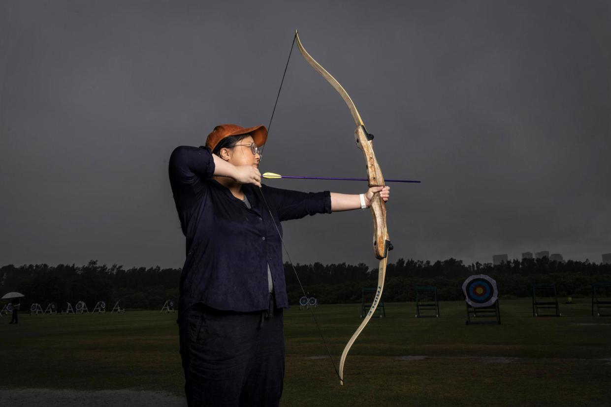 <span>‘Cupid I am not’: Jennifer Wong attends her first archery class at Sydney Olympic Park Archery Centre.</span><span>Photograph: Jessica Hromas/The Guardian</span>
