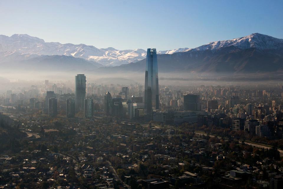 TOPSHOT - View of smog over Santiago, on June 16, 2018 due to which Chilean authorities declared a new environmental preemergence, as high levels of air pollution were recorded. (Photo by CLAUDIO REYES / AFP)        (Photo credit should read CLAUDIO REYES/AFP/Getty Images)