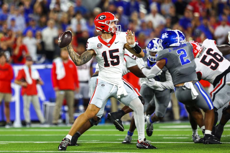 Sep 14, 2024; Lexington, Kentucky, USA; Georgia Bulldogs quarterback Carson Beck (15) drops back to pass against the Kentucky Wildcats during the first quarter at Kroger Field. Mandatory Credit: Carter Skaggs-Imagn Images