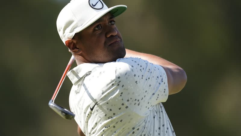 Tony Finau watches his tee shot on the seventh hole during the third round of the U.S. Open golf tournament at Los Angeles Country Club on Saturday, June 17, 2023, in Los Angeles. (AP Photo/Marcio J. Sanchez)