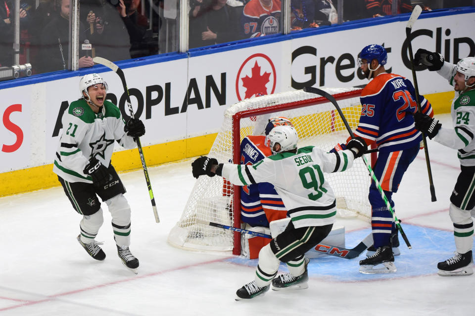 Jason Robertson celebrates his first career playoff hat trick during Monday's win. (Leila Devlin/Getty Images)