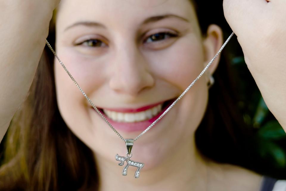 Maya Satnick wears a Hebrew chai necklace to honor her Jewish faith. She recently organized an event to counter antisemitism at San Diego State University campus.