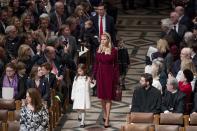 <p>For the National Prayer Service at the Washington National Cathedral on Jan. 21, 2017, Ivanka wore a burgundy velvet wrap dress coat with suede pumps. She styled her hair with a headband. (Photo: AP Images) </p>