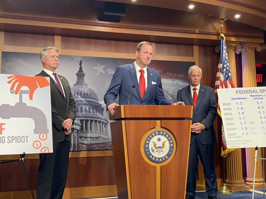 : Missouri Republican U.S. Sen. Eric Schmitt speaks during a press conference on Capitol Hill on Wednesday, May 15, 2024. Kansas Republican Sen. Roger Marshall stands at the left and Wisconsin Republican Sen. Ron Johnson is on the right. (Photo by Jennifer Shutt/States Newsroom)