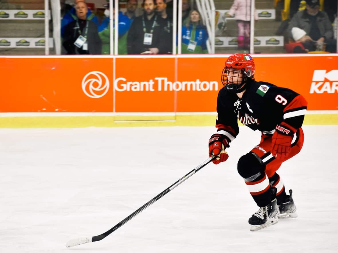 Team Yukon's captain Gavin McKenna on the ice at the Canada Winter Games in Charlottetown on Tuesday. McKenna set a record on Thursday, for most points scored in a men's tournament at the games. (Basil Eldho - image credit)