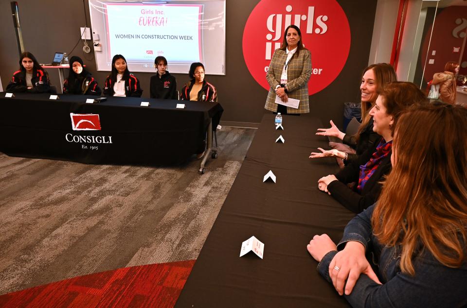 Jody Staruk speaks while sharing a panel with Victoria Waterman and Allison James during a Women in Construction Week STEM cohort at Girls Inc. in Worcester last week.