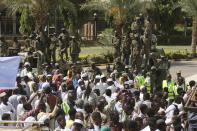 Sudanese protesters take part in a rally demanding the dissolution of the transitional government, outside the presidential palace in Khartoum, Sudan, Saturday, Oct. 16, 2021. (AP Photo/Marwan Ali)