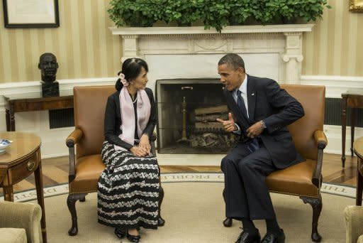 US President Barack Obama meets with Myanmar's Aung San Suu Kyi in the Oval Office. Both Nobel laureates, Obama and Suu Kyi, who wore a black blouse, black and white lunghi wrap skirt and a pink scarf, sat side-by-side, smiling, as photographers were ushered into the room before their private meeting