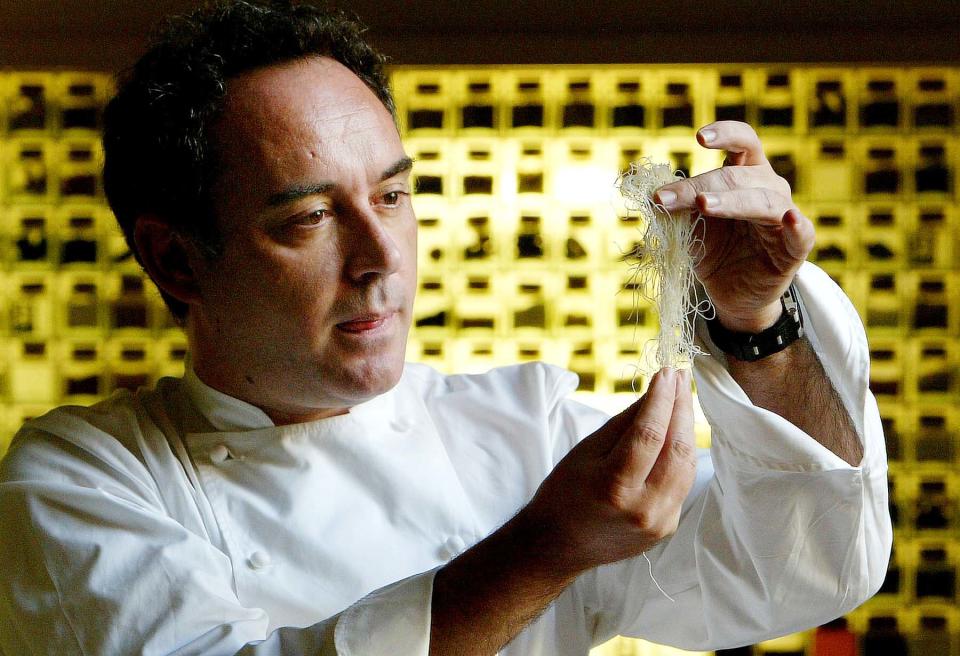 FILE - In this Dec. 5, 2003 file photo, Spanish chef Ferran Adria examines ingredients in his kitchen workshop in Barcelona, Spain. Spanish chef Ferran Adria, the man behind the late, lamented elBulli restaurant, is bringing an exhibition dedicated to the art and science of his experimental brand of cooking to London. The show, which was visited by 650,000 people during a year-long run in Barcelona, will be on display from July 5 to Sept. 29, 2013 at London's Somerset House. (AP Photo/Bernat Armangue, File)