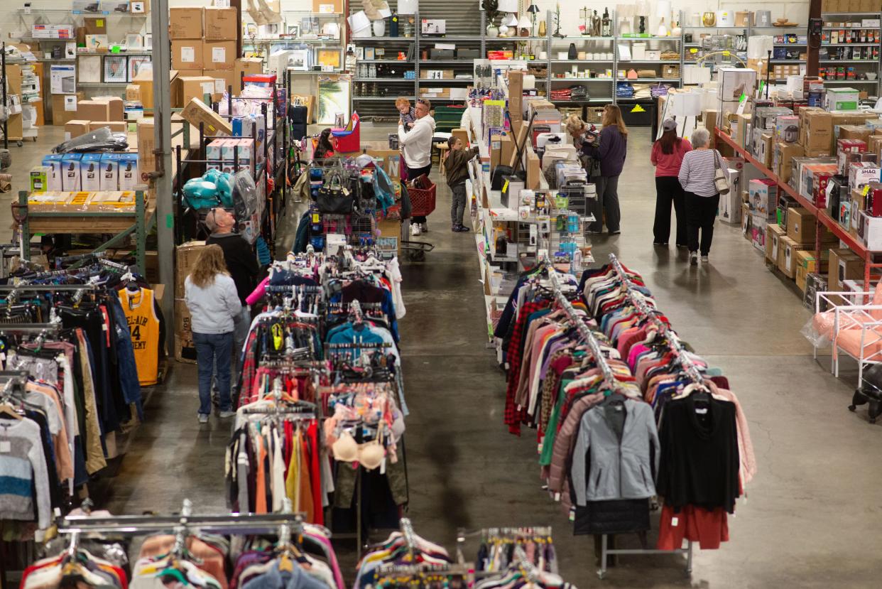 Shoppers at RJ's Discount Store, 3729 S.W. South Park Ave., look for deals throughout the various sections of discounted items Saturday afternoon.