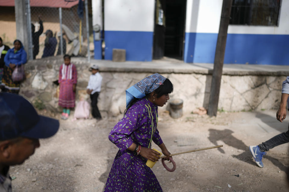 Rarámuri runner Evelyn Rascon competes in the Arihueta race in Cuiteco, Mexico, Saturday, May 11, 2024. The 13-year-old runner said that “professionally” she has only run half marathons — around 13 miles — in “no less” than an hour and a half. (AP Photo/Eduardo Verdugo)