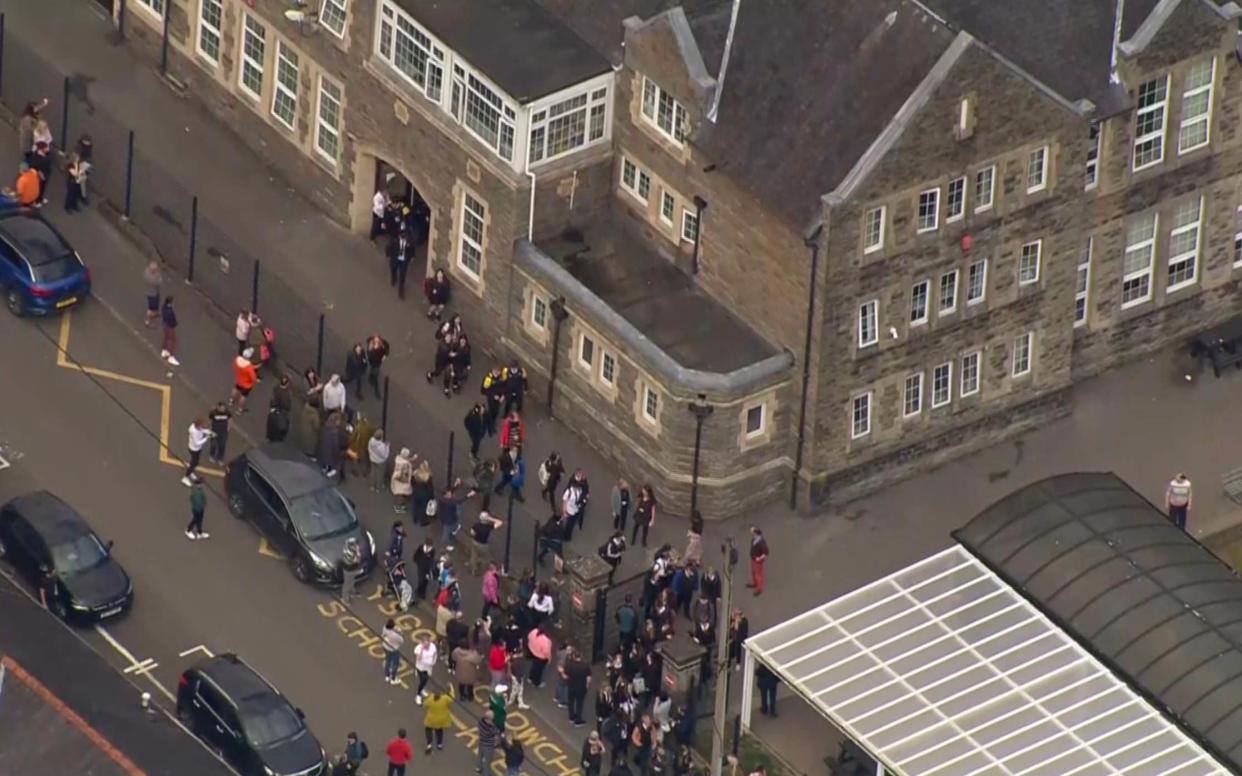 Amman Valley School as parents line the school gates after as pupils leave the school