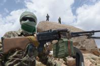 <p>Afghan security forces keep watch in Daykundi province on May 11, 2016.<br> Nili, the capital of Daykundi, one of the thirty-four provinces of Afghanistan, is located about 310 kilometres west of Kabul. (Photo: Shah Marai/ AFP/Getty Images) </p>