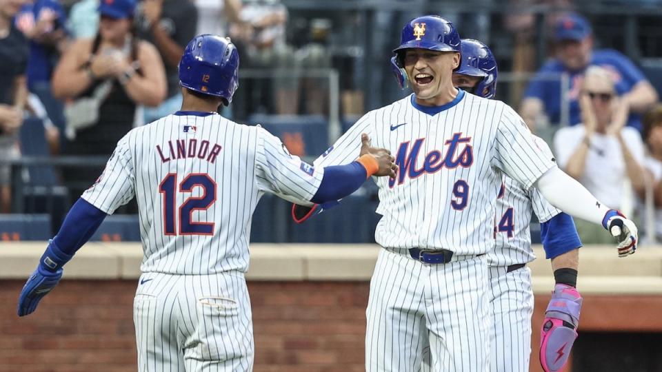 New York Mets left fielder Brandon Nimmo (9) is greeted by shortstop Francisco Lindor (12) after hitting a three run home run in the second inning against the Washington Nationals at Citi Field.