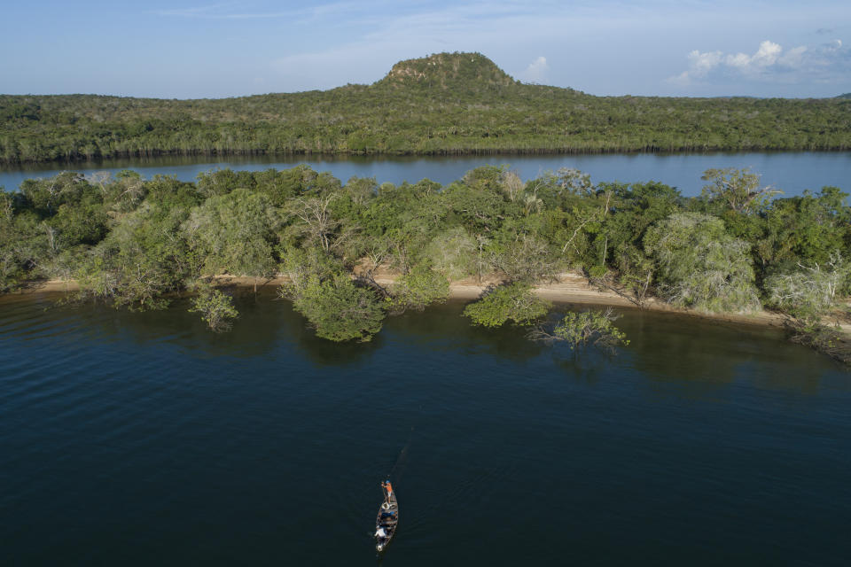 FILE - Fishermen work in the Tapajos River in Alter do Chao, district of Santarem, Para state, Brazil, Aug. 27, 2020. (AP Photo/Andre Penner, File)