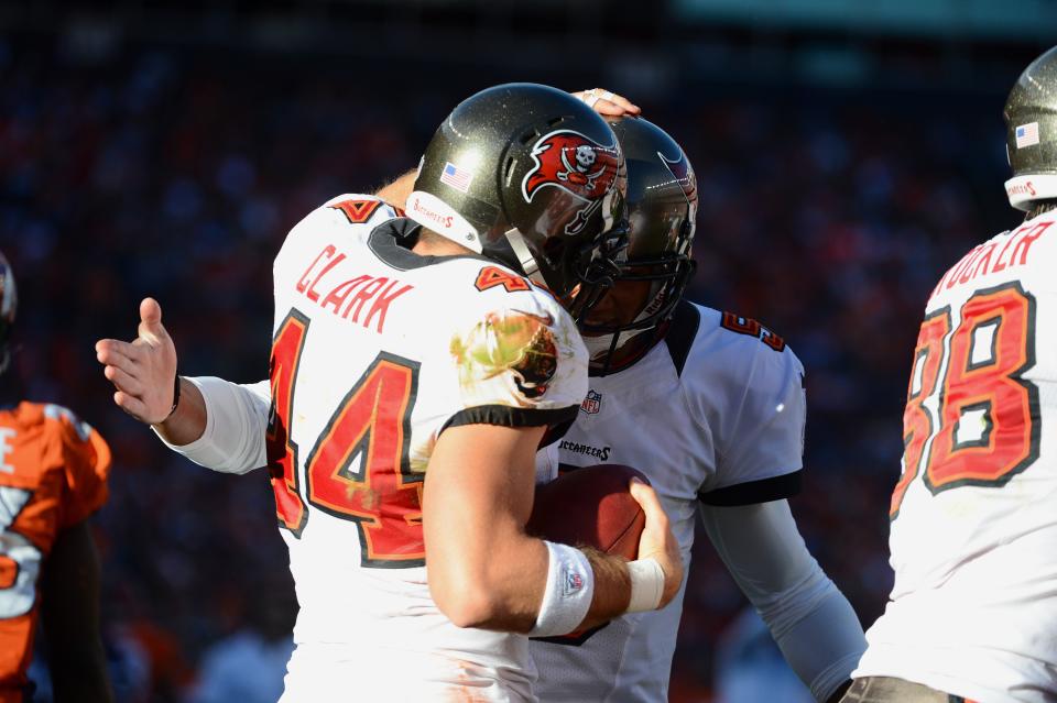 Dallas Clark #44 celebrates his touchdown with Josh Freeman #5 of the Tampa Bay Buccaneers during the game against the Denver Broncos at Sports Authority Field at Mile High on December 2, 2012 in Denver, Colorado. (Photo by Garrett W. Ellwood/Getty Images)