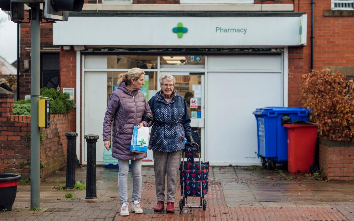 A mature woman out and about with her mother in Seghill, Northumberland