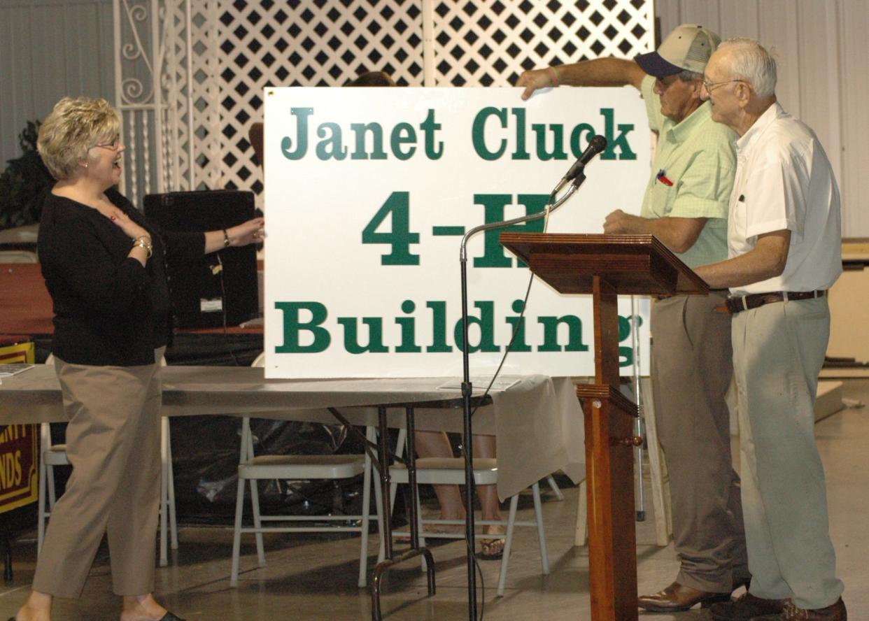 UT Extension-Dickson Director Janet Cluck had the 4-H Building at the Dickson County Fairgrounds named in her honor in 2011. Dickson County Fair Association president Edgar Meek presented the sign to her at a fair board dinner that year.