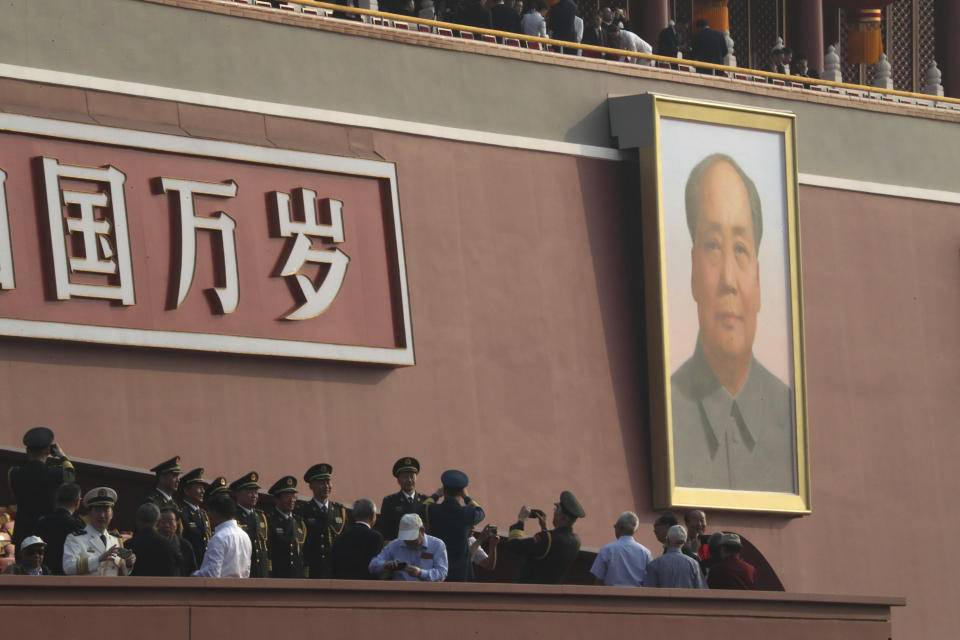 The large portrait of former Chinese leader Mao Zedong is seen on Tiananmen Gate near Tiananmen Square in Beijing, before the start of a parade to mark the 70th anniversary of the founding of the People's Republic of China in Beijing on Tuesday, Oct. 1, 2019. (AP Photo/Ng Han Guan)