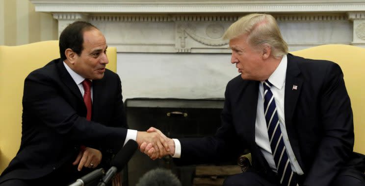 President Trump shakes hands with Egyptian President Abdel Fattah al-Sisi in the Oval Office.