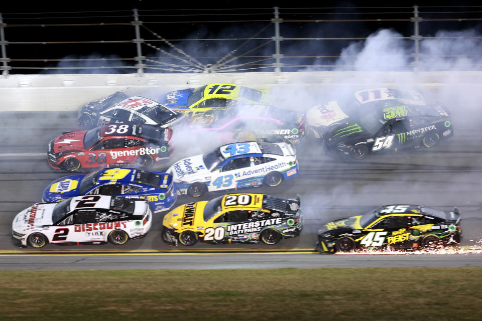 Multiple cars crash in turn 3 during the final laps of the NASCAR Daytona 500 auto race at Daytona International Speedway, Monday, Feb. 19, 2024, in Daytona Beach, Fla. (AP Photo/Mike Troxell)