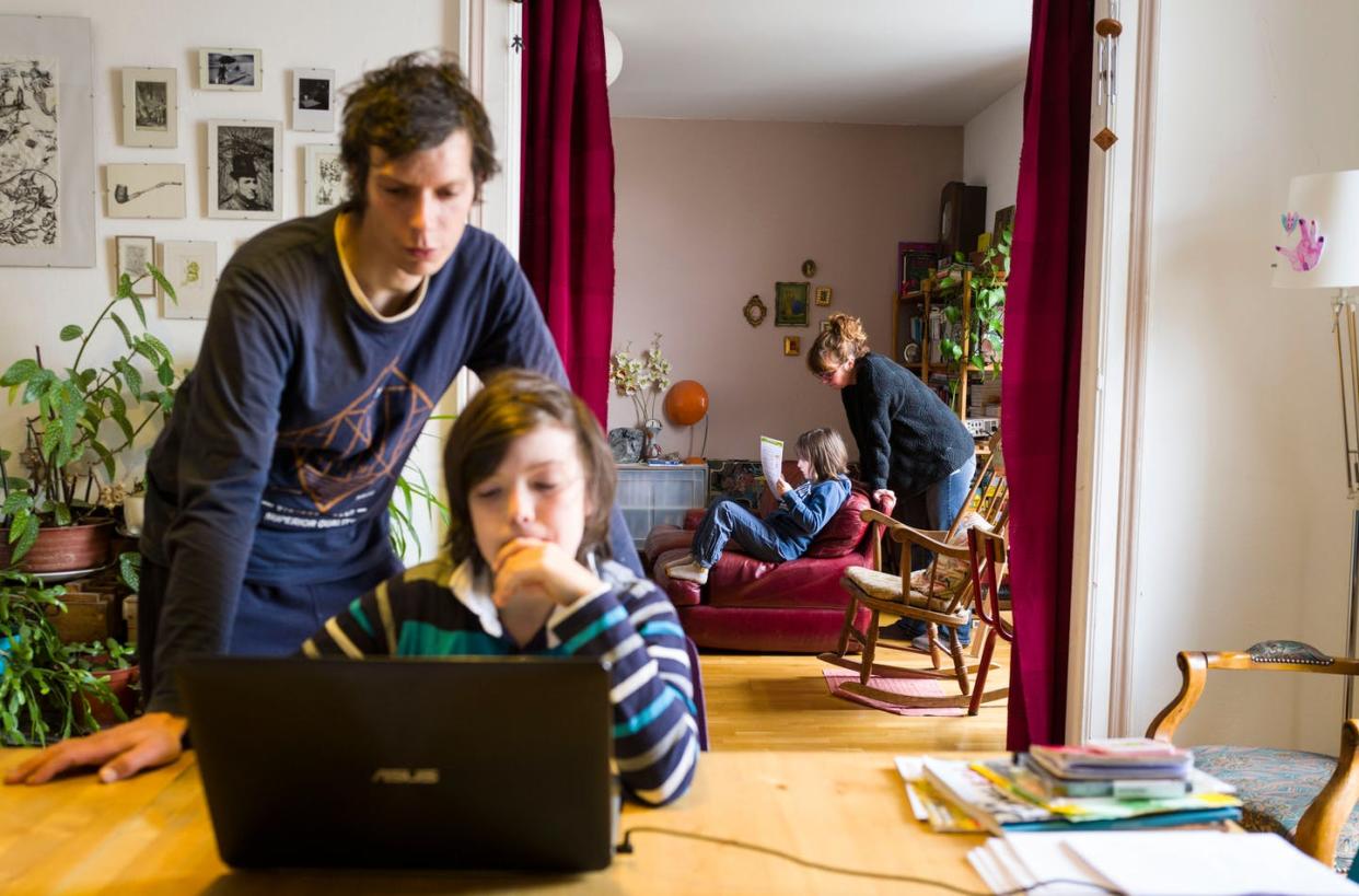 <span class="caption">Involving children while setting up family schedules gives them ownerhship over behavior. </span> <span class="attribution"><a class="link " href="https://www.gettyimages.com/detail/news-photo/landry-martin-and-fanny-delque-helps-their-children-mathias-news-photo/1207489465?adppopup=true" rel="nofollow noopener" target="_blank" data-ylk="slk:Sebastien Bozon/AFP via Getty Images;elm:context_link;itc:0;sec:content-canvas">Sebastien Bozon/AFP via Getty Images</a></span>