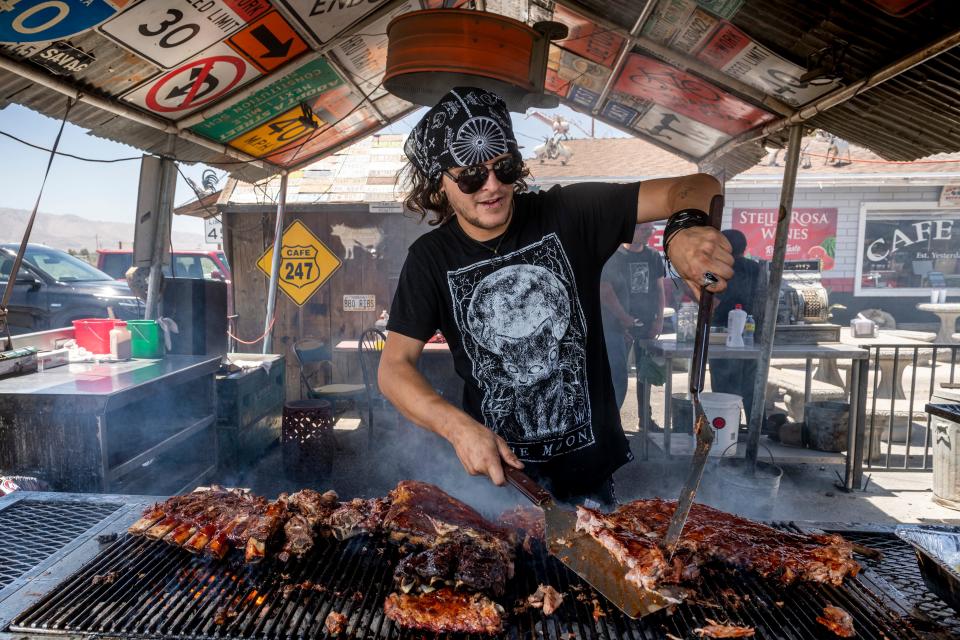 Ezra Holt preparing ribs at Cafe 247 in Lucerne Valley .