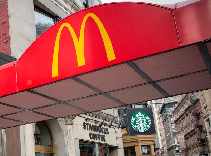 FILE PHOTO: McDonald's Golden Arches are seen next to a Starbucks at the Union Square location in New York