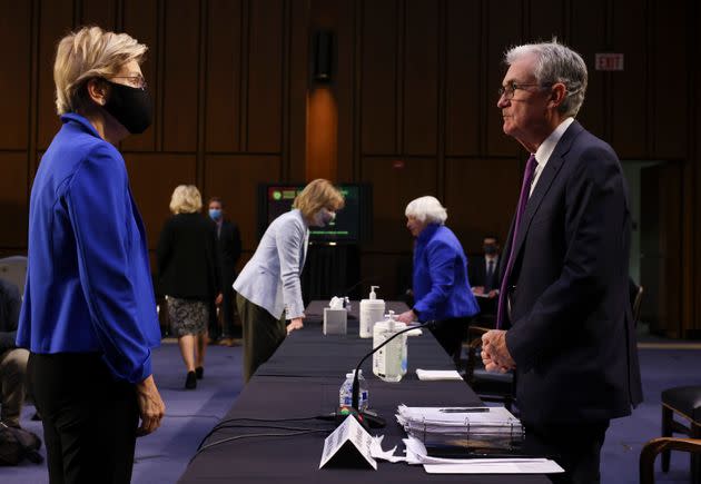 Sen. Elizabeth Warren (D-Mass.) talks to Federal Reserve Chairman Jerome Powell on Tuesday. Shortly after, Warren announced she would oppose Powell's renomination to lead the nation’s central bank. (Photo: Kevin Dietsch via Getty Images)