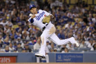 Los Angeles Dodgers shortstop Manny Machado throws out San Francisco Giants' Andrew McCutchen during the fifth inning of a baseball game Tuesday, Aug. 14, 2018, in Los Angeles. (AP Photo/Mark J. Terrill)