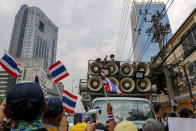 Nithitorn Lamleau, a leader of the Thai monarchy supporters address the gathering outside German Embassy in central Bangkok, Thailand Monday, Oct. 26, 2020. The royalists gathered to defend pro-democracy protesters' contention that King Maha Vajiralongkorn spends much of his time in Germany conducting Thai political activities. German government officials have recently expressed concern over political activities the king might be conducting on the Germany's soil. (AP Photo/Gemunu Amarasinghe)