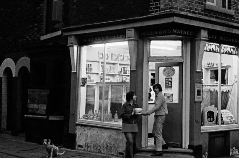 A corner shop at dusk, Salford, 1969.