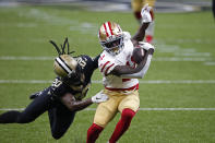 San Francisco 49ers wide receiver Brandon Aiyuk (11) tries to evade New Orleans Saints cornerback Janoris Jenkins (20) in the first half of an NFL football game in New Orleans, Sunday, Nov. 15, 2020. (AP Photo/Butch Dill)