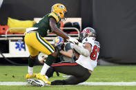 Tampa Bay Buccaneers tight end Rob Gronkowski (87) scores a touchdown in front of Green Bay Packers strong safety Adrian Amos (31) during the first half of an NFL football game Sunday, Oct. 18, 2020, in Tampa, Fla. (AP Photo/Jason Behnken)