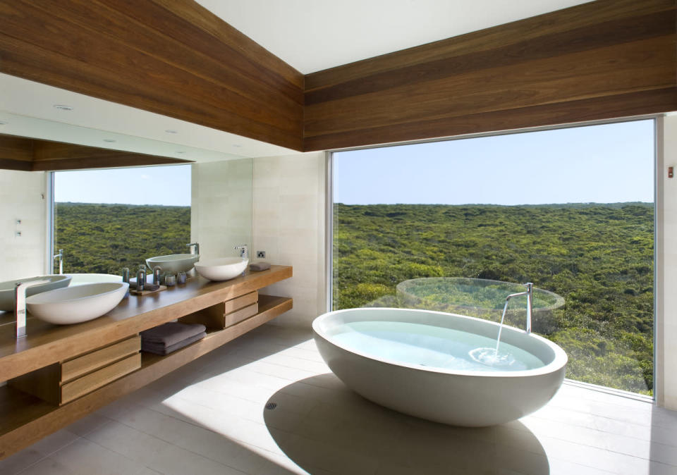 <p>One third of the 90-mile-long island is conservation land which fur seals, koalas, kangaroos, and sea lions call home. This design hotel offers a front row seat, from the comfort of your tub. (Photo: Southern Ocean Lodge)</p>