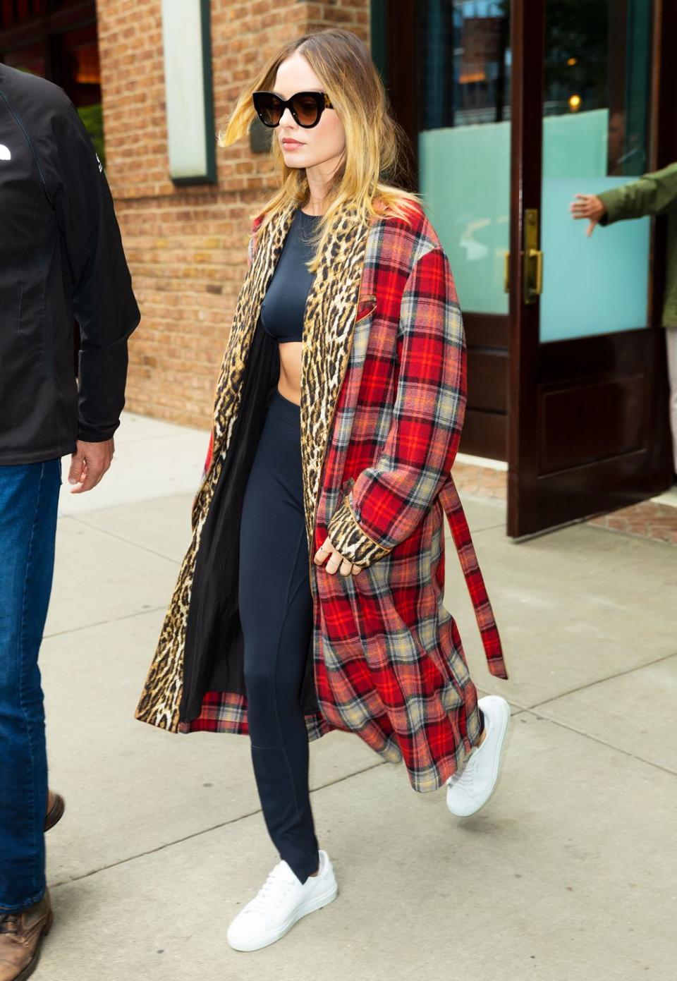 <p>The actress delivered a masterclass in how to clash prints with this R13 checked coat, with an leopard print lining, in New York. Margot kept the rest of her look nice and simple - with a black crop top, leggings and white trainers - to keep the attention firmly on the coat.</p><p><strong>Get the look: </strong></p><p><a class="link " href="https://www.net-a-porter.com/gb/en/product/1181971" rel="nofollow noopener" target="_blank" data-ylk="slk:SHOP NOW;elm:context_link;itc:0;sec:content-canvas">SHOP NOW</a> R13 Leopard-print crepe-trimmed checked wool-blend coat, £1,335, Net-A-Porter</p>