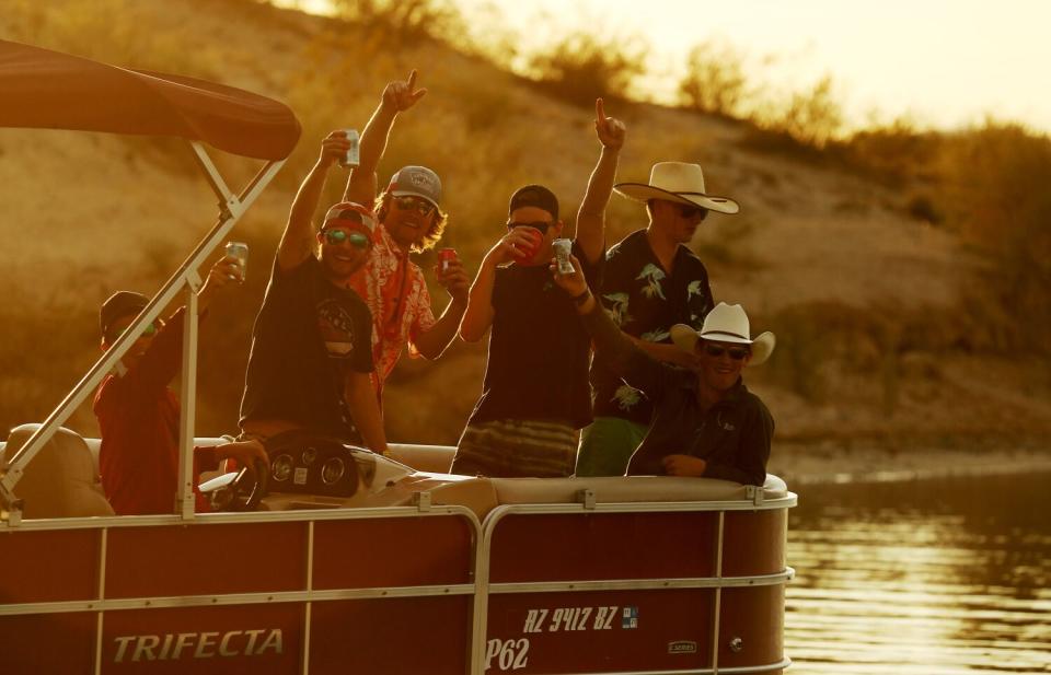 Boaters raise a drink and cruise around Lake Havasu.