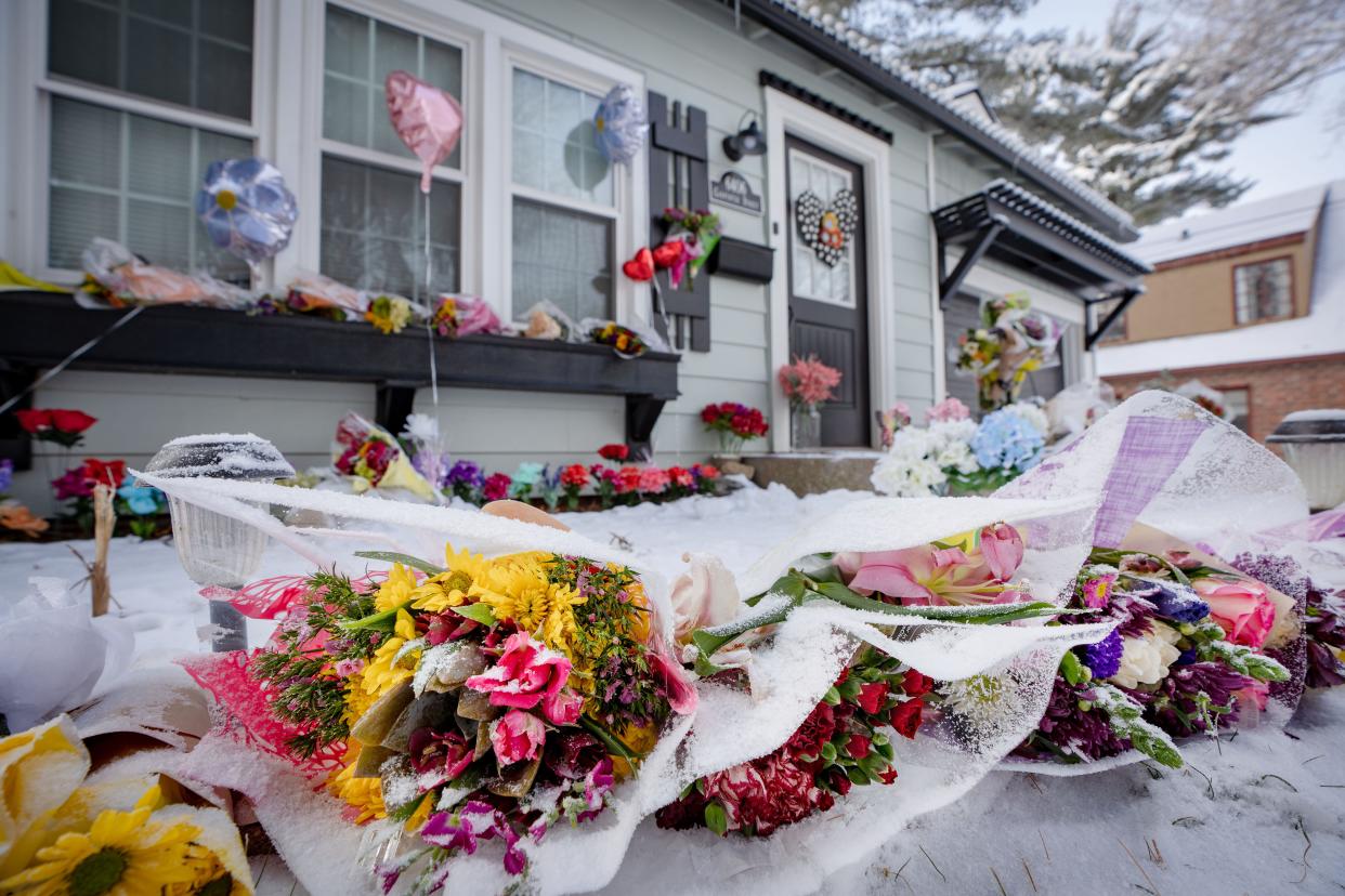 A dusting of snow blankets flowers left by mourners outside of Kristie Allen's home in Windsor Heights. Shot to death JaN. 18, She was among six women to die in the Des Moines metro in the past two months in domestic violence-related shootings.