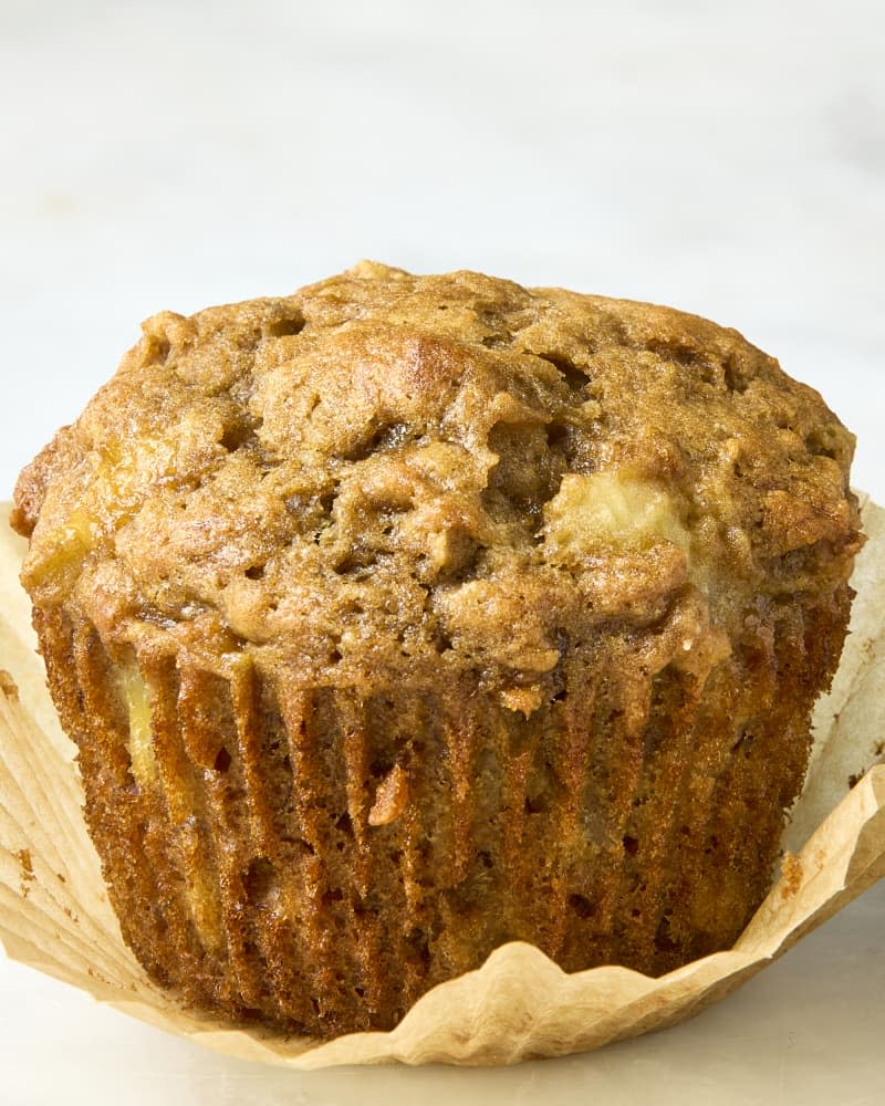 head on shot of a banana muffin with the wrapping taken off of it