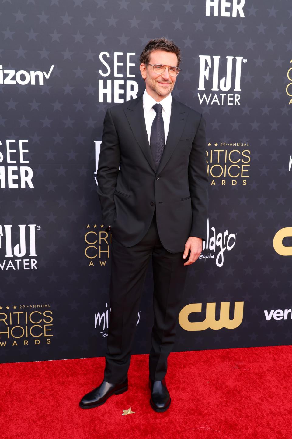 Bradley Cooper beams a smile on the red carpet of the Critics Choice Awards.