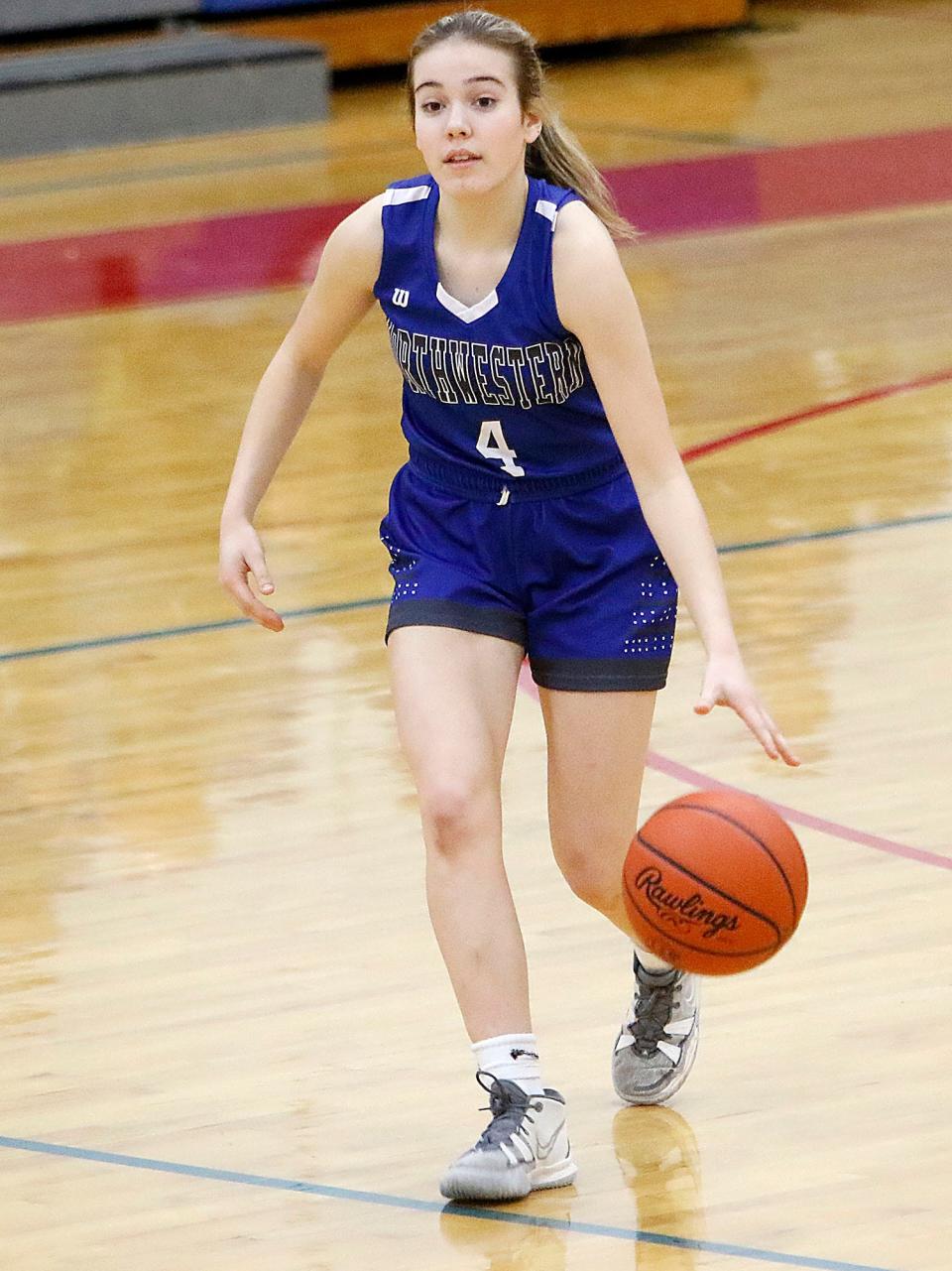 Northwestern High School's Caydence Scale (4) brings the ball down court against Mapleton High School during high school girls basketball action on Tuesday, Jan. 18, 2022 at Mapleton High School. TOM E. PUSKAR/TIMES-GAZETTE.COM