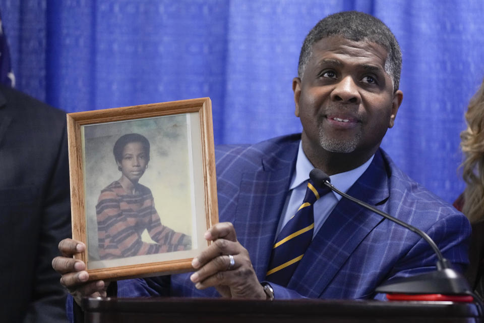 John Moye, son of Laverne Moye, holds up a picture of his mother while speaking at a news conference after Richard Cottingham appeared remotely in a courtroom in Mineola, N.Y., Monday, Dec. 5, 2022. Cottingham, the serial murderer known as the "Torso Killer", admitted Monday to killing a 23-year-old woman outside a Long Island shopping mall in 1968 and four other women decades ago, including Laverne Moye. (AP Photo/Seth Wenig)